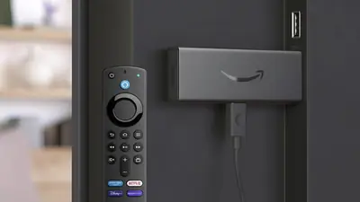 Amazon Fire TV Stick with remote mounted on a television